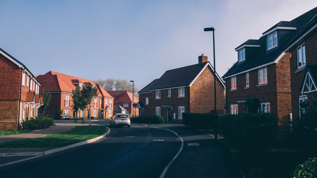testimonials-img Serene morning view of an English suburban street lined with charming red-brick houses in Farnham.